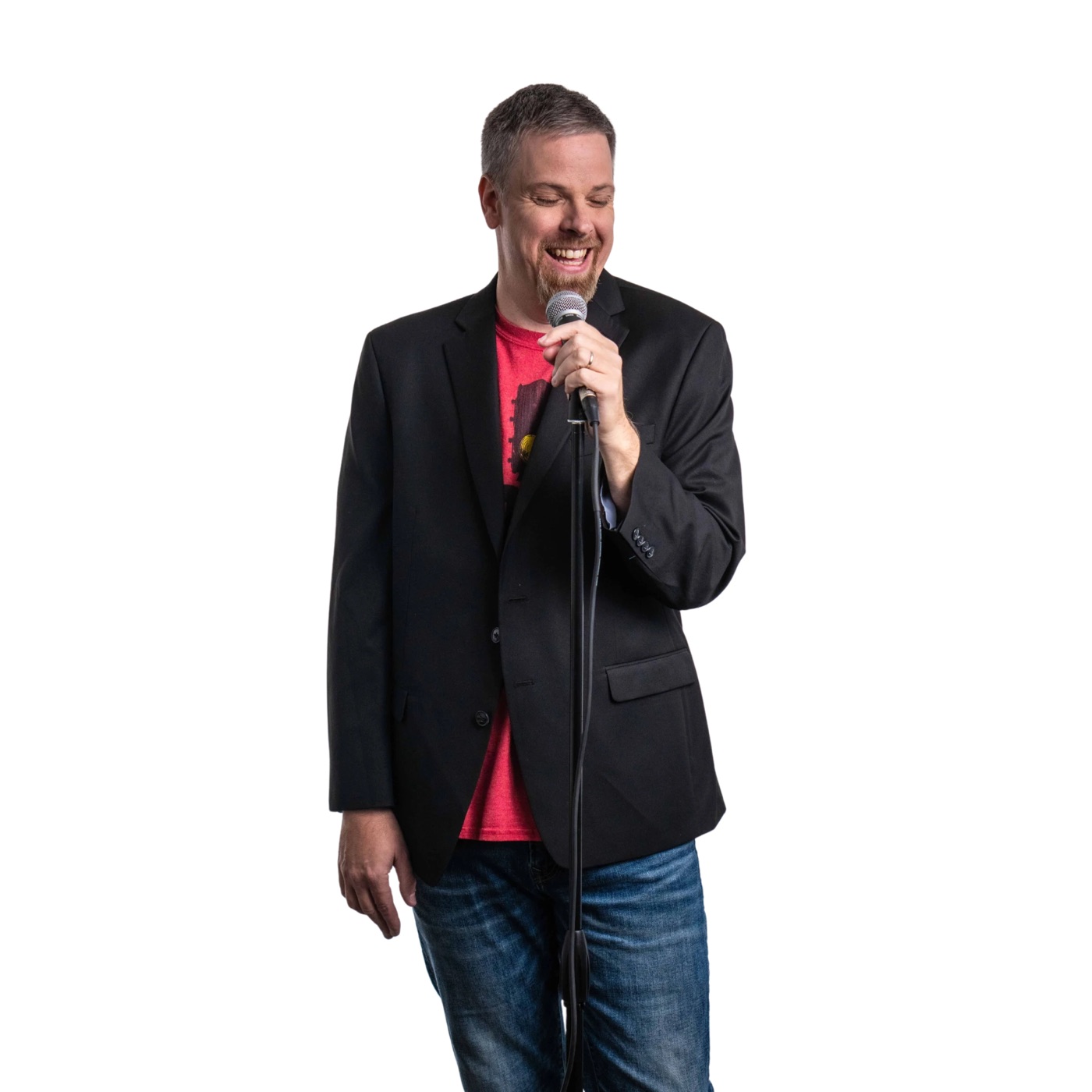 Jonnie W. laughing into a microphone